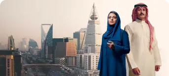 Two professionals in traditional Saudi attire with the Riyadh skyline including Kingdom Centre and Al Faisaliyah Center