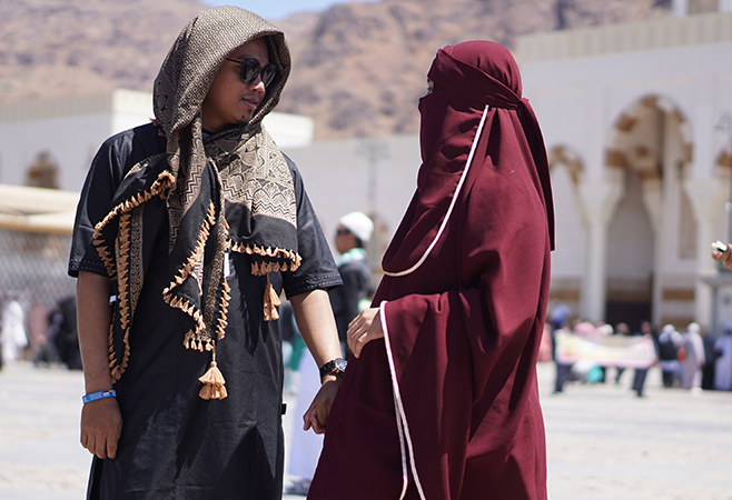 Tourists respectfully follow Saudi Arabia’s dress code and public conduct rules