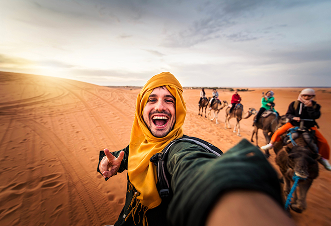 Tourists exploring Saudi Arabia while following Saudi Arabia’s cultural dress code and public behavior guidelines
